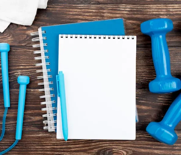 blue-notebook-with-dumbbells_Activ Living Community