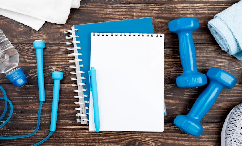 blue-notebook-with-dumbbells_Activ Living Community