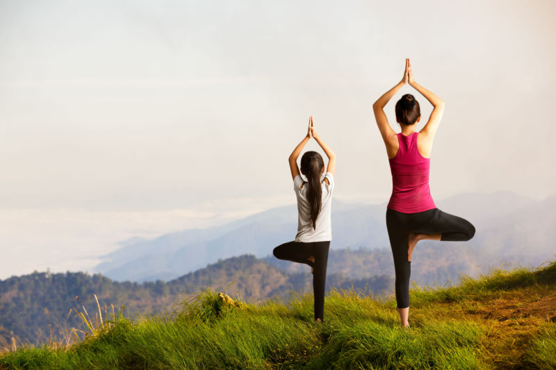 Mother and daughter doing yoga_Activ Living Community