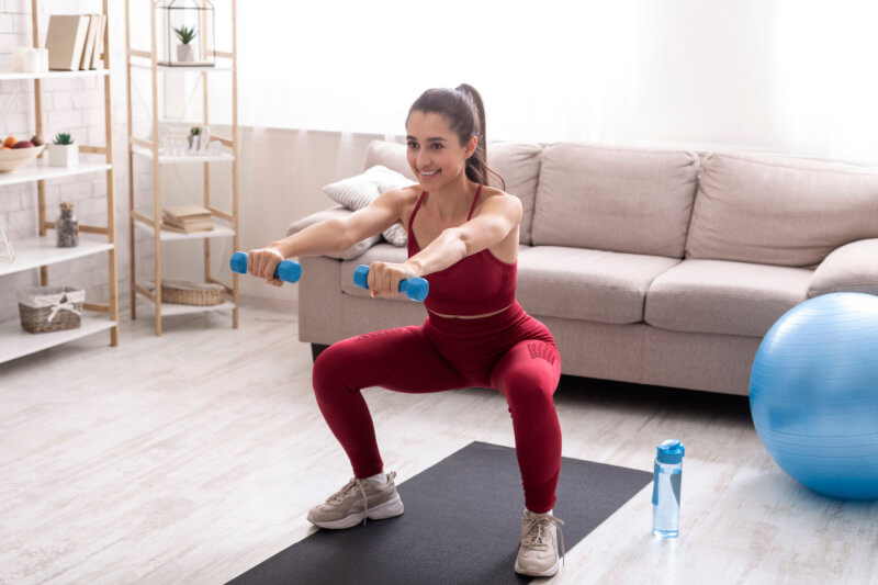 Women holding dumbbell -Fitness workout