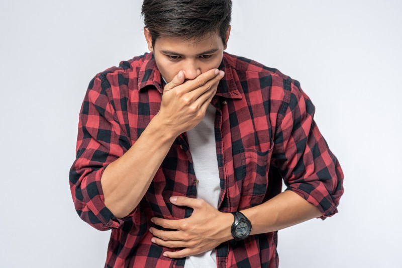 man-standing-with-stomachache-put-your-hands-your-stomach-cover-your-mouth 1_Activ Living Community