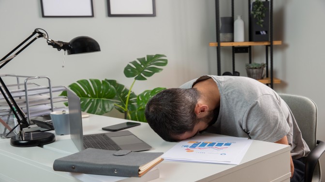 man-feeling-sleepy-while-working-from-home (h)_Activ Living Community