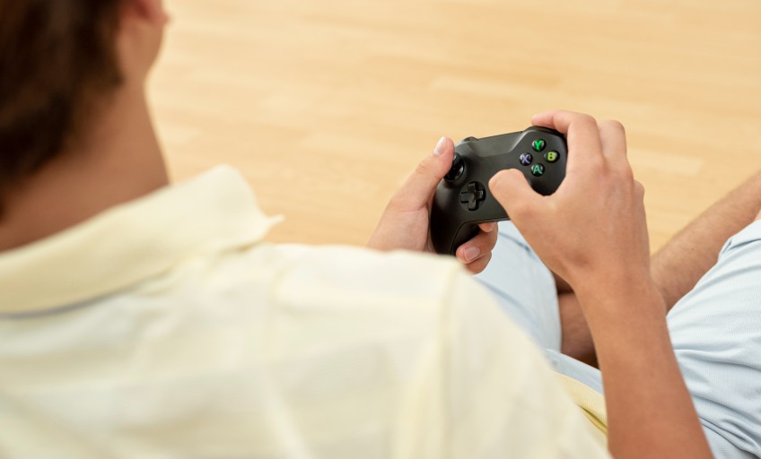 close-up-boy-holding-game-controller f_Activ Living Community