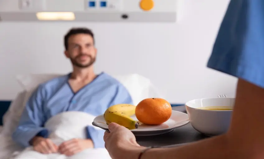 male-patient-with-jaundice-bed-talking-nurse (1)_Activ Living Community