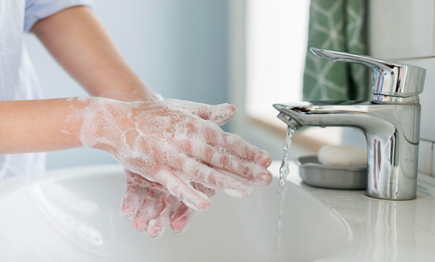 side-view-person-washing-hands-sink (1)_Activ Living Community