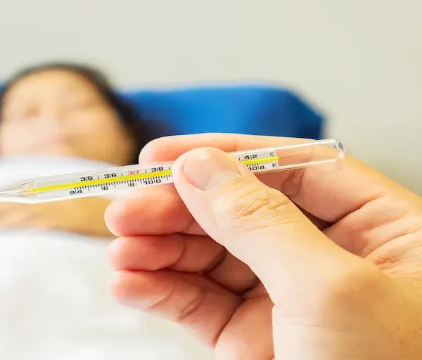 doctor-is-looking-thermometer-measuring-body-temperature-his-patient_Activ Living Community