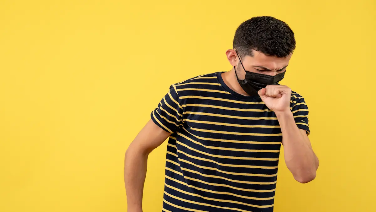 front-view-young-man-black-white-striped-t-shirt-coughing-yellow-background_Activ Living Community