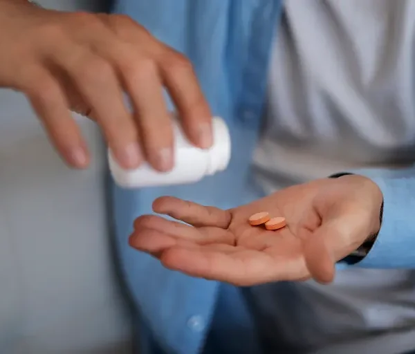 high-angle-hand-holding-pills_Activ Living Community