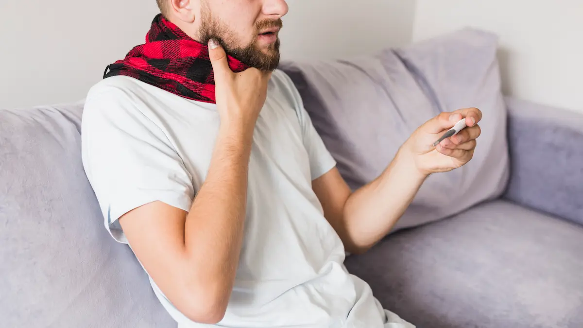 man-checkered-scarf-with-thermometer_Activ Living Community