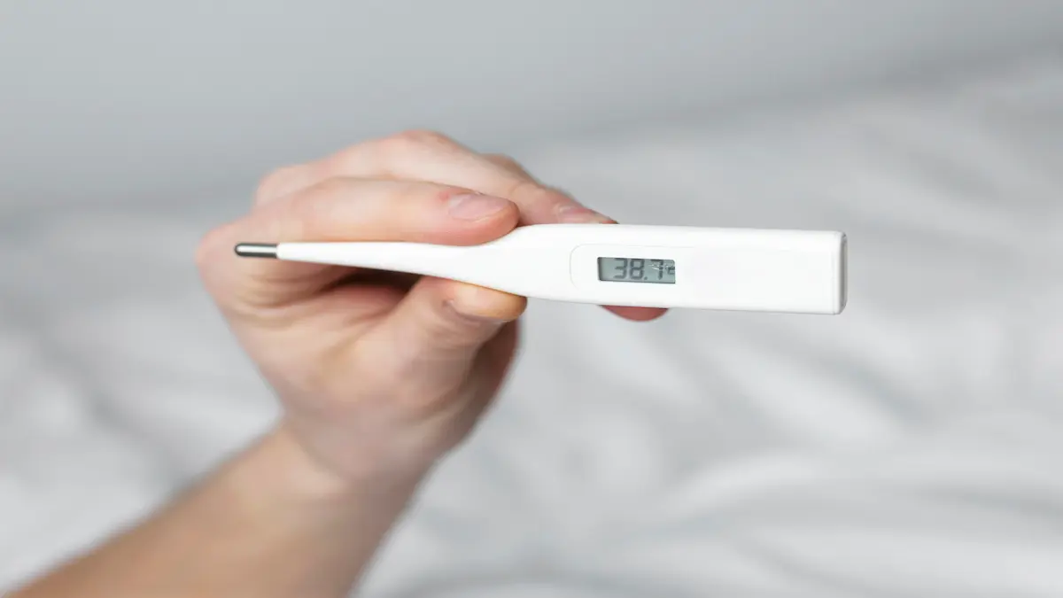 man-looking-his-temperature-thermometer_Activ Living Community