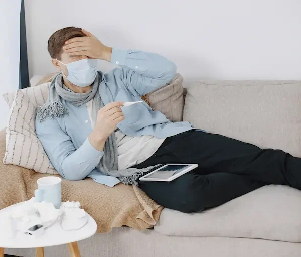 sick-guy-living-room-middle-age-man-feeling-sick-with-cold-fever-home-man-medical-mask_Activ Living Community