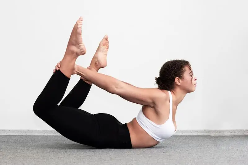 side-view-fit-woman-holding-her-legs (1)_Activ Living Community