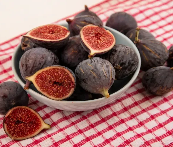 top-view-soft-black-mission-figs-bowl-checked-cloth-white-surface_Activ Living Community