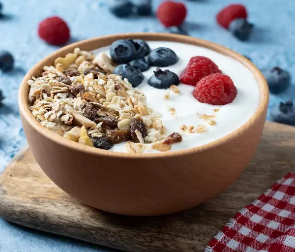 yogurt-with-berries-muesli-breakfast-bowl-blue-background_Activ Living Community