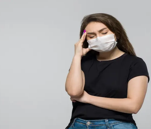 young-woman-black-t-shirt-white-sterile-medical-mask-having-strong-headache_Activ Living Community