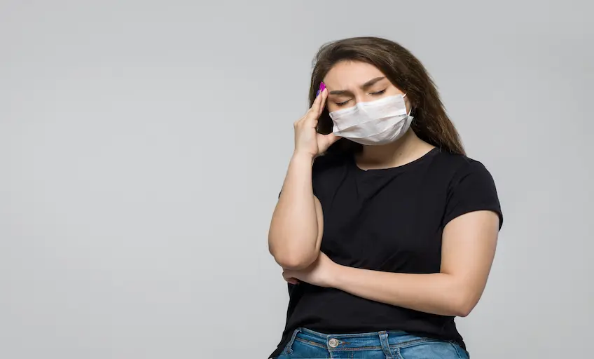 young-woman-black-t-shirt-white-sterile-medical-mask-having-strong-headache_Activ Living Community