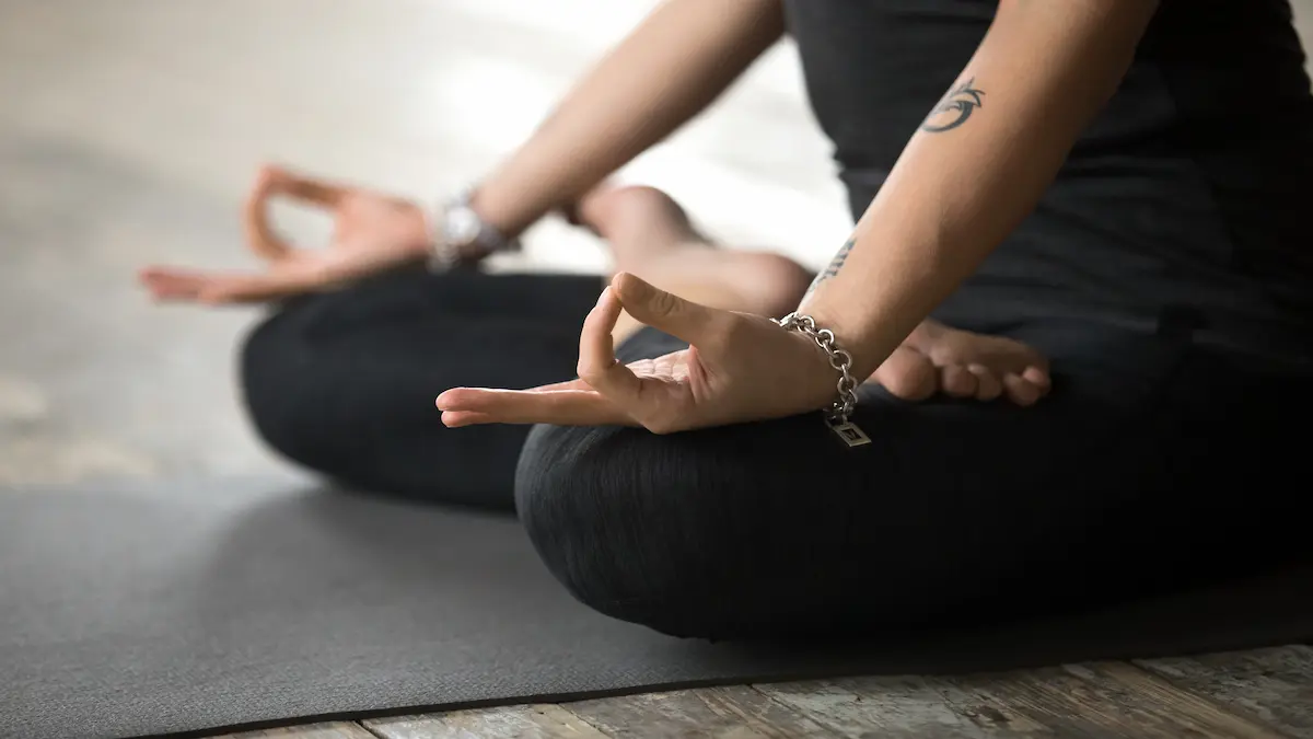 young-woman-doing-padmasana-exercise-mudra-gesture-close-up_Activ Living Community