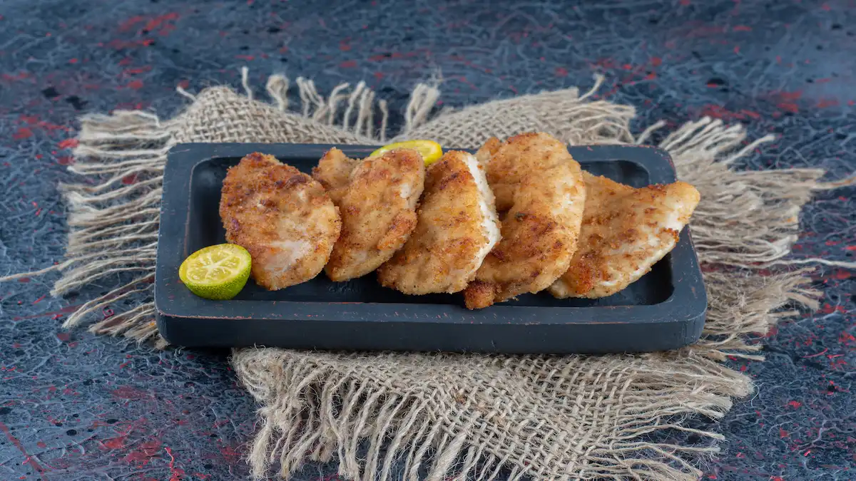 dark-wooden-board-with-baked-chicken-meat-with-slices-lemon (7)_Activ Living Community
