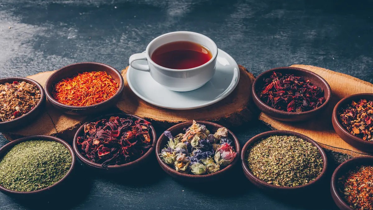 tea-herbs-bowls-with-wood-stubs-cup-tea-high-angle-view-dark-textured-background-space-text_Activ Living Community