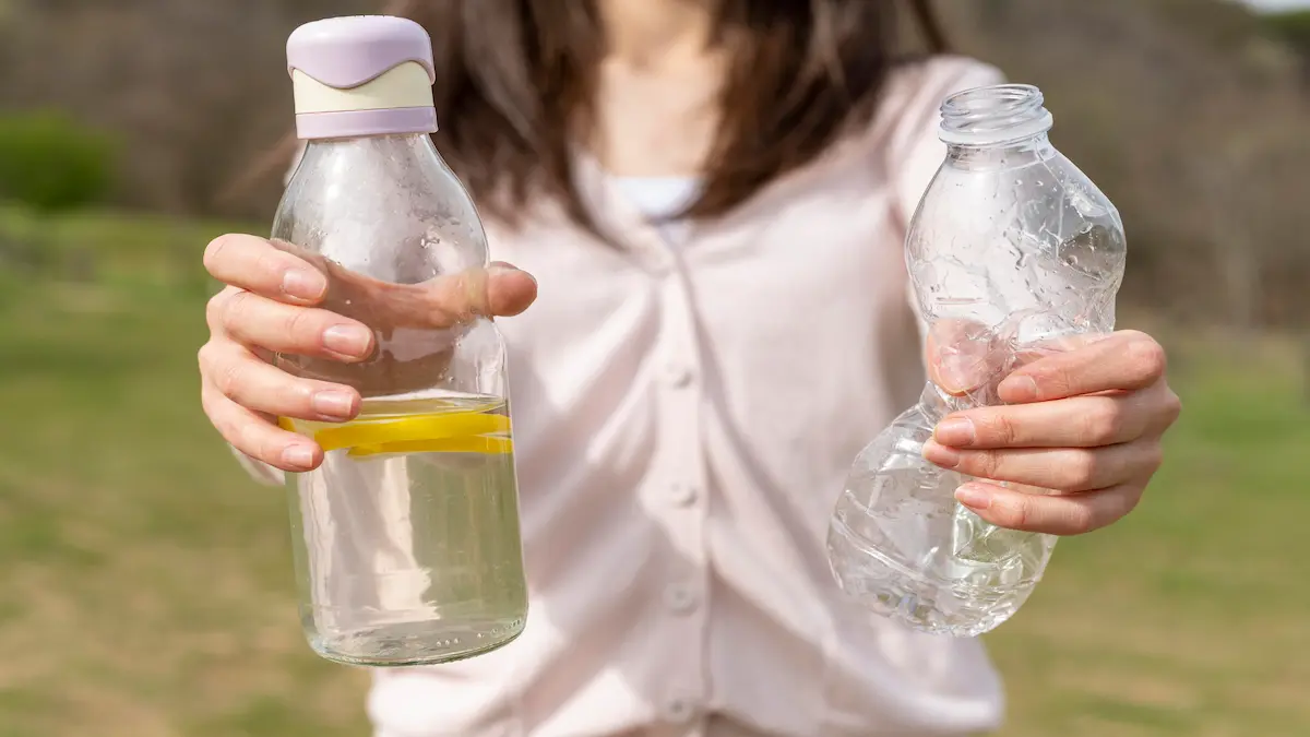 close-up-woman-holding-glass-plastic-bottles_Activ Living Community