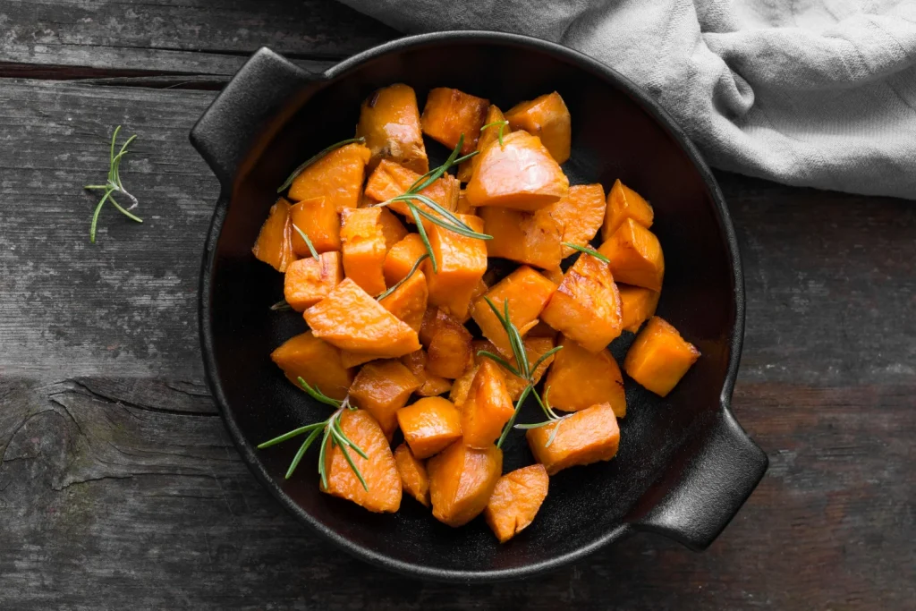 Roasted sweet potato in a cast iron pan
